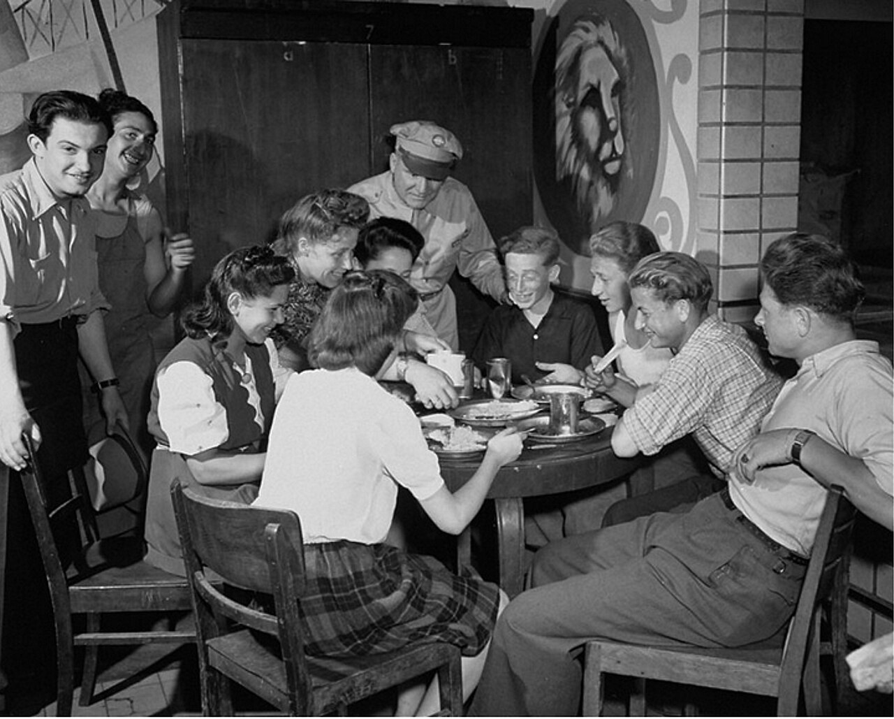 Context photograph: an UNRRA officer visits a group of young refugees at Eschwege displaced persons camp, Germany, on 7 July 1946; they are not identified as Sara Neumann.